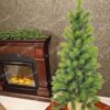 Umělý vánoční stromek 100% 3D Mini Smrk je v moderním květináči a má zelené jehlice.